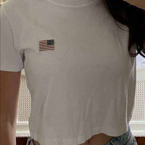 It is a white shirt from Brandy Melville. - Picture 2 of 3